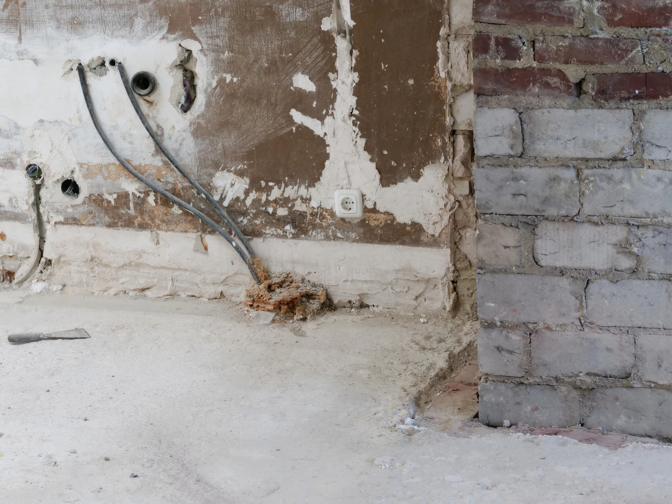 Interior renovation site with exposed electrical wiring