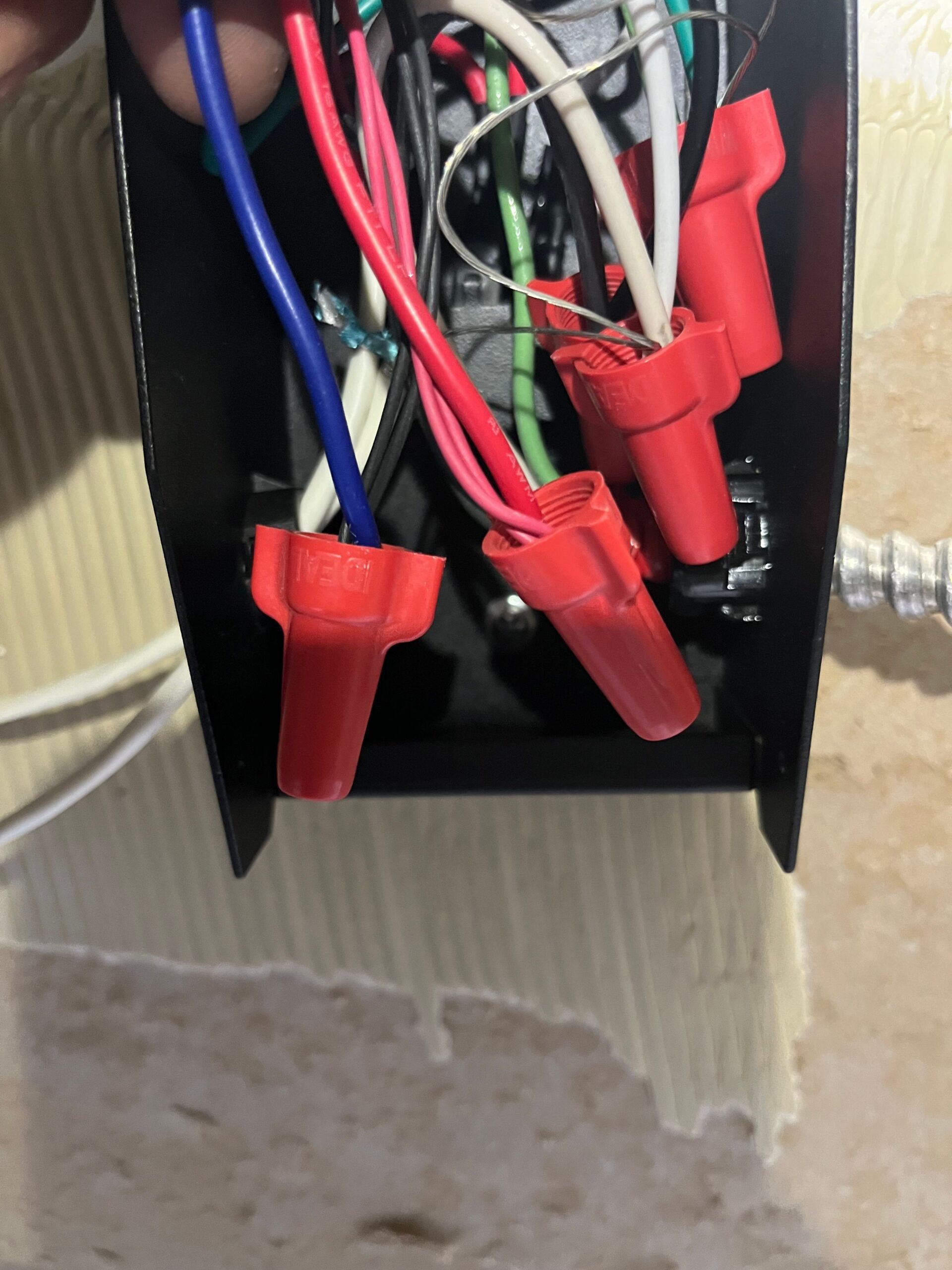 Electrician working on home rewiring during renovation
